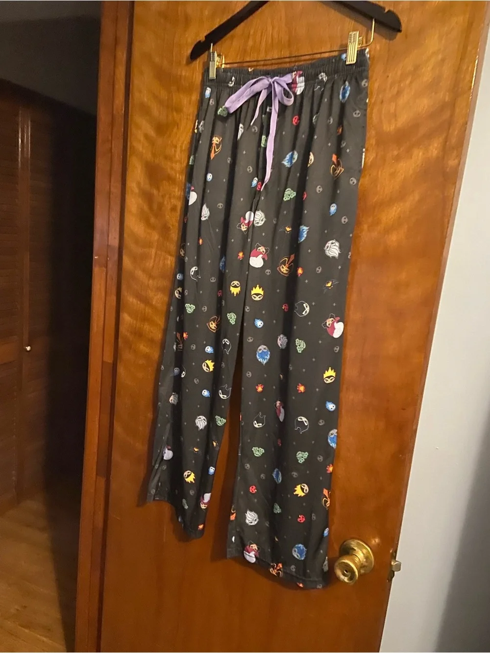 Disney Black Pajama Pants with Multicolor Space Characters and Purple Drawstring - Picture 1 of 3